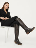 The Legacy: Distressed Black Knee-High Western Boots with a Snip Toe